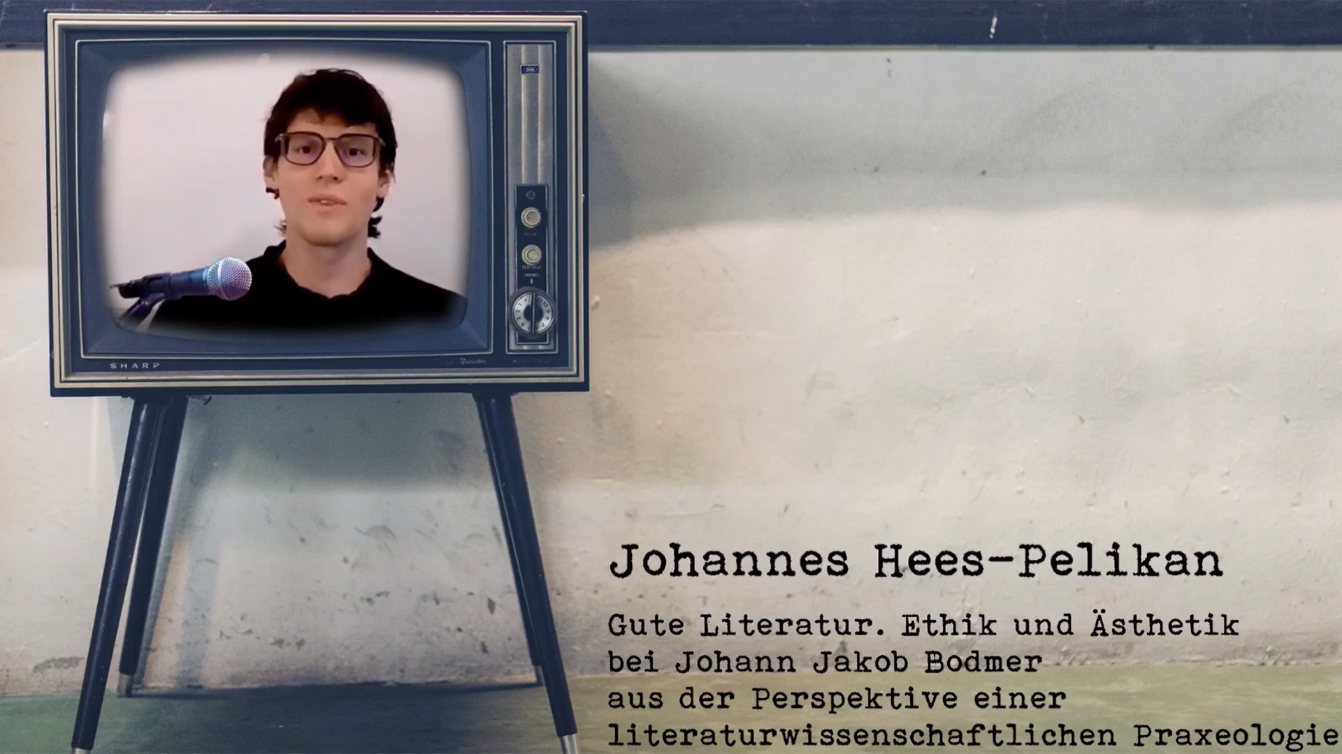 Das Bild zeigt einen Screenshot vom Youtube-Video mit Johannes Hees